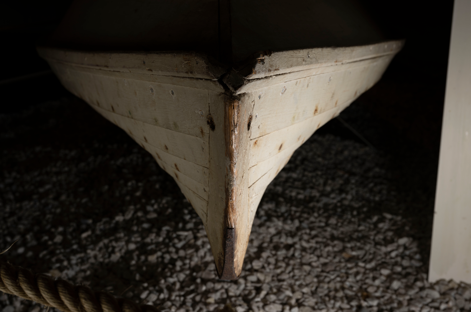 The prow of the gooseboat, the rest of the boat in shadow 